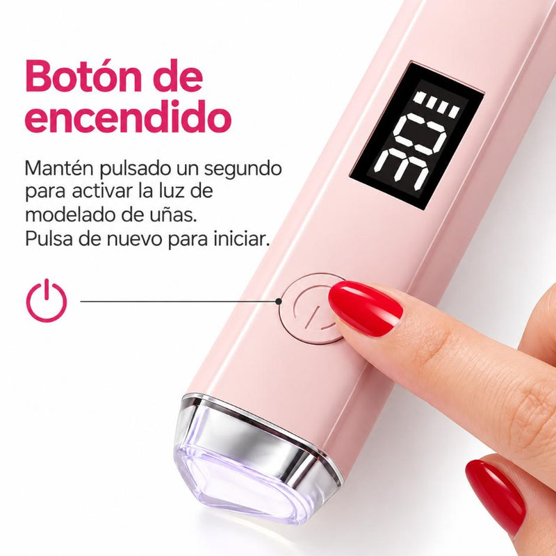 Botón de encendido de la lámpara de moldeado rosa, con una uña roja junto al cabezal