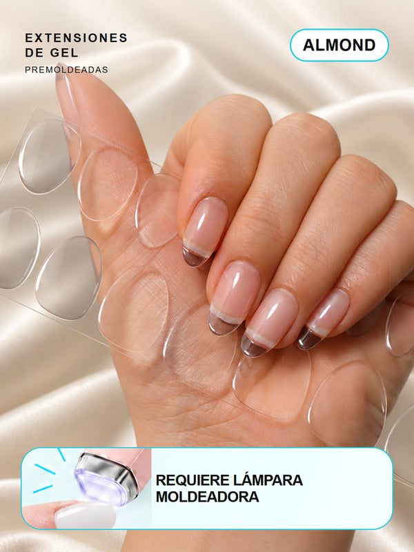 Extensiones de gel NOOVES Crystal Clear, forma almond, mano y tira sobre satén en tarjeta
