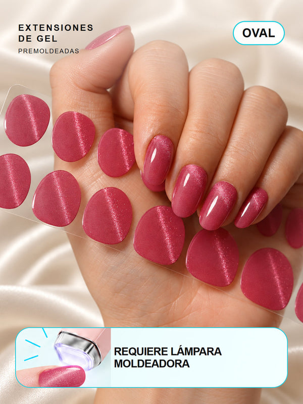 Extensiones de gel NOOVES Mystic Rose, forma oval, mano y tira sobre satén en tarjeta