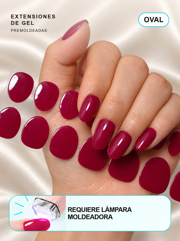 Extensiones de gel NOOVES Fuchsia Night, forma oval, mano y tira sobre satén en tarjeta